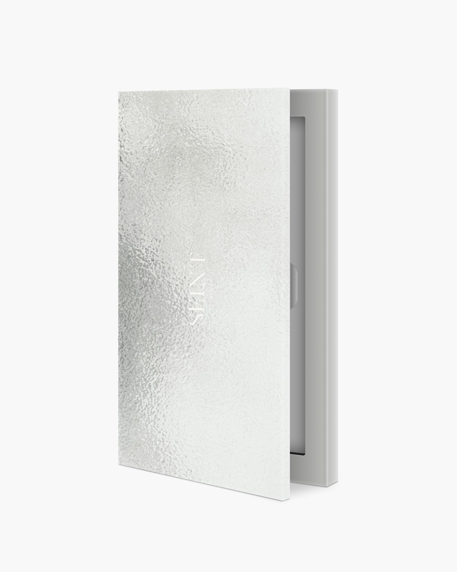 Seint IIID Palette 4 in Silver, slim compact with textured metallic foil cover, shown upright and cracked open
