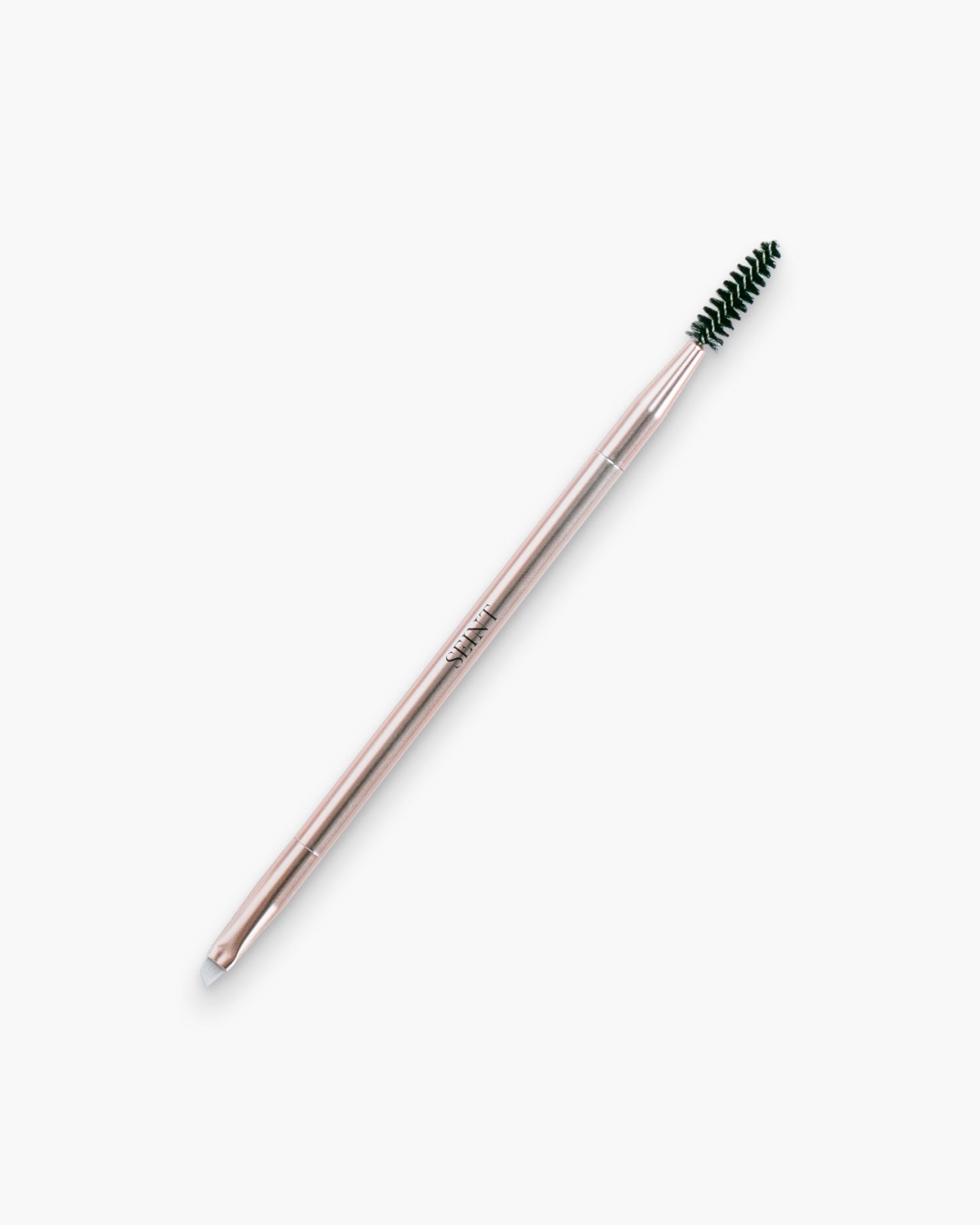 Seint Line Brush in rose gold, a double-ended brush pairing a black spoolie with an angled flat liner tip