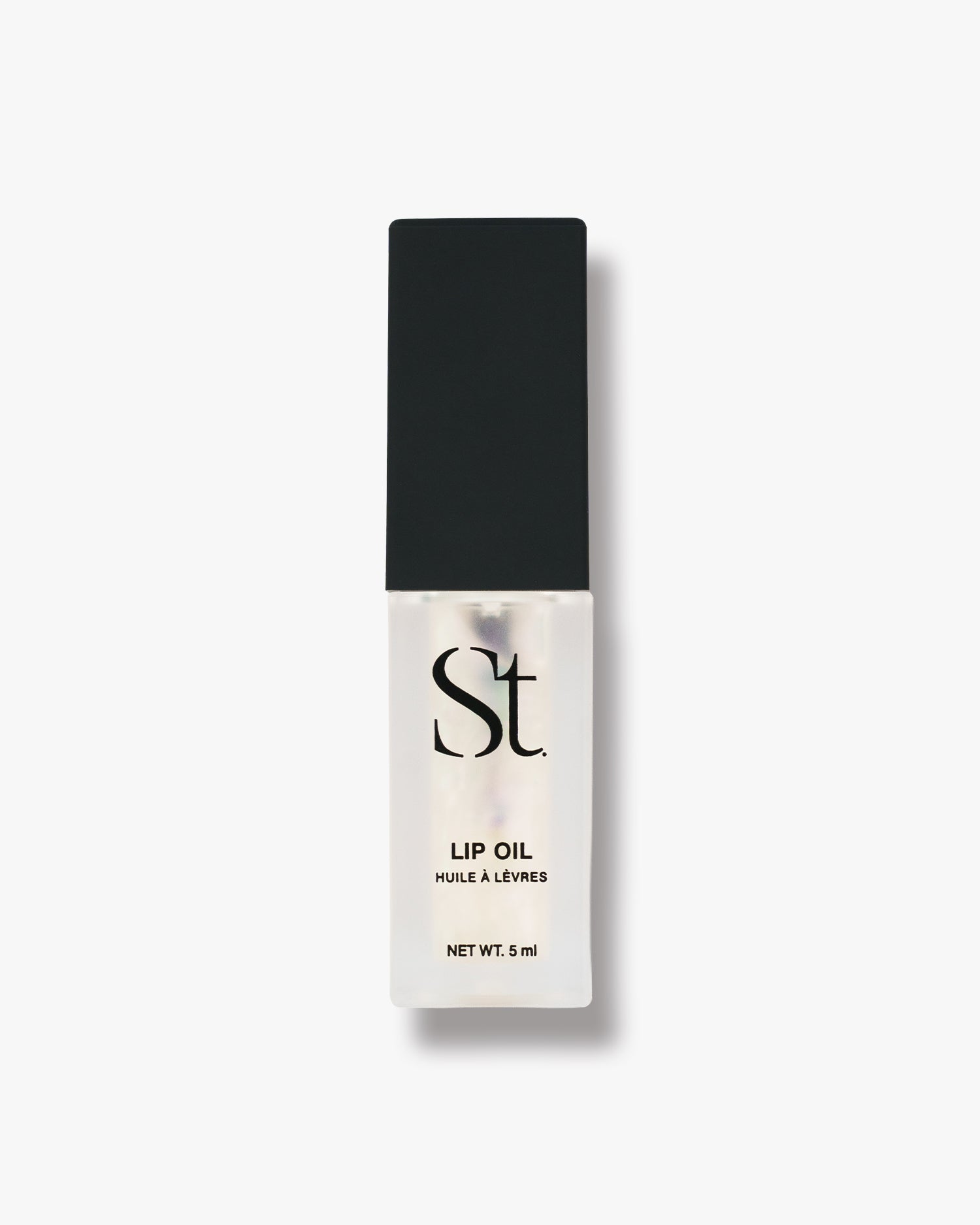 Seint Lip Oil in Birthday, clear opalescent oil in the labeled frosted bottle, front packaging view