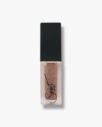 Seint Lip Oil in Salted Caramel, sheer caramel-taupe oil with a pearl swirl in the frosted bottle