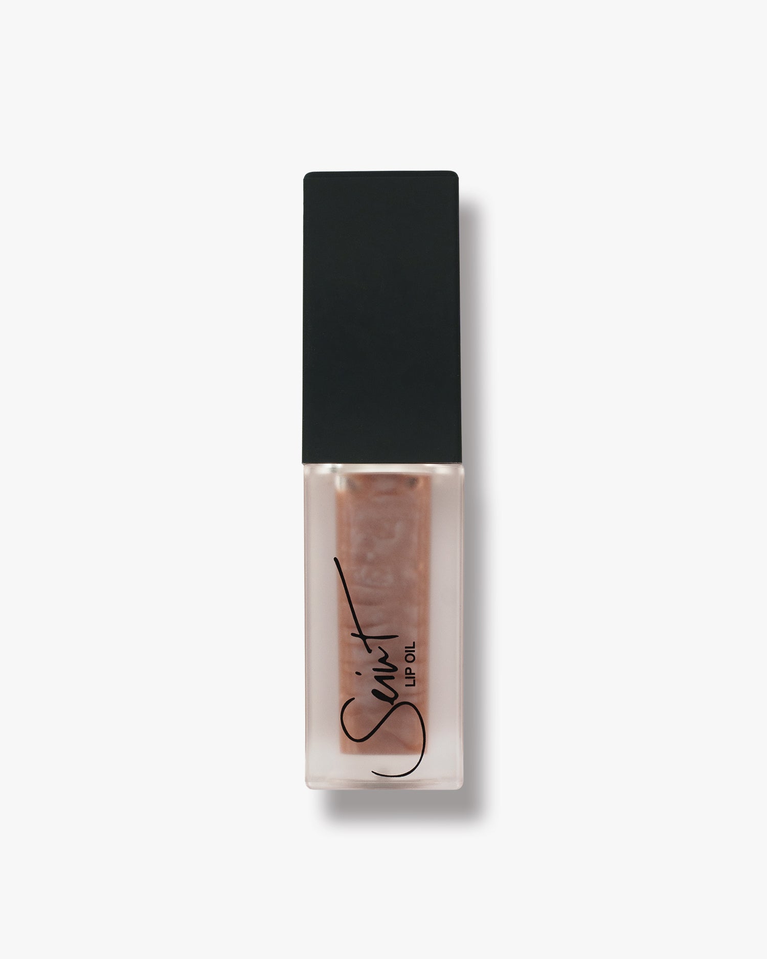 Seint Lip Oil in Salted Caramel, sheer caramel-taupe oil with a pearl swirl in the frosted bottle