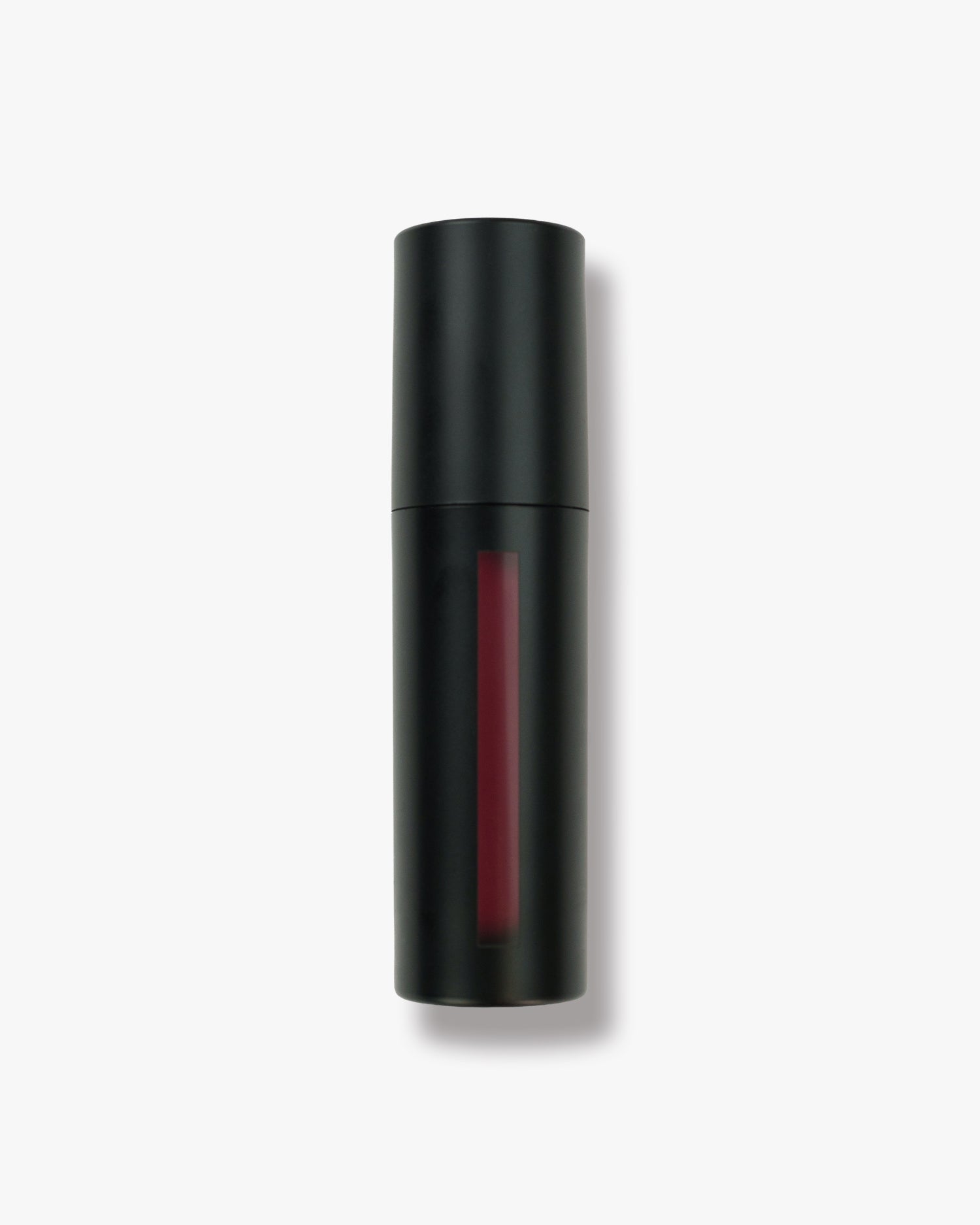 Seint Lip Tint in Cherry — matte black bottle with a slim window showing rich cherry-red liquid tint