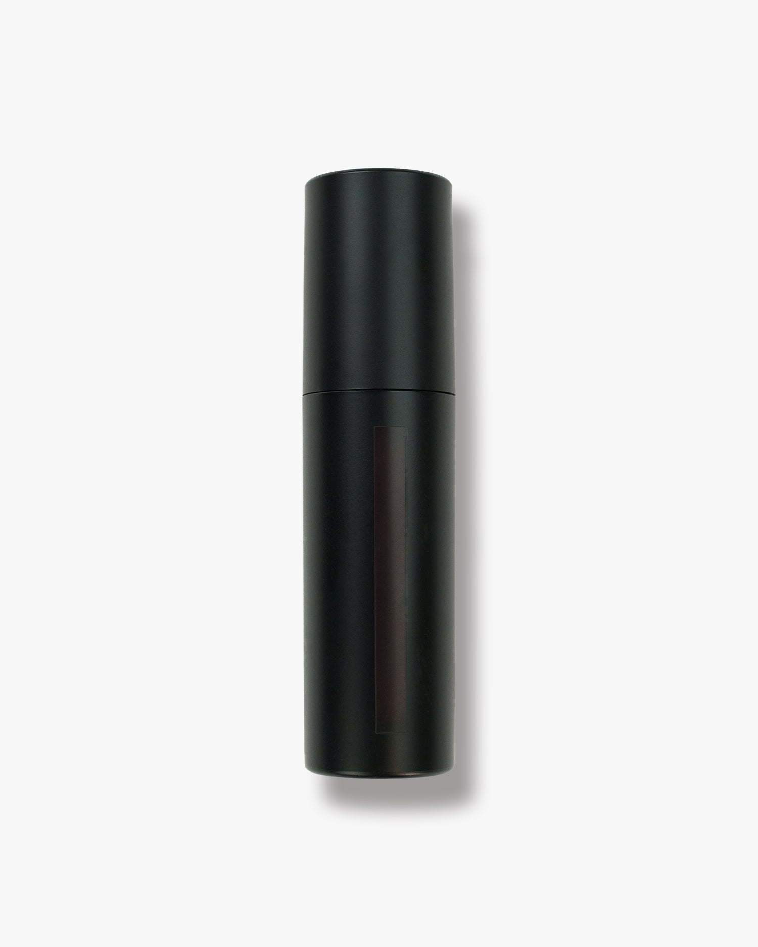 Seint Lip Tint in Jam — black bottle whose slim window shows a very deep blackberry-brown tint