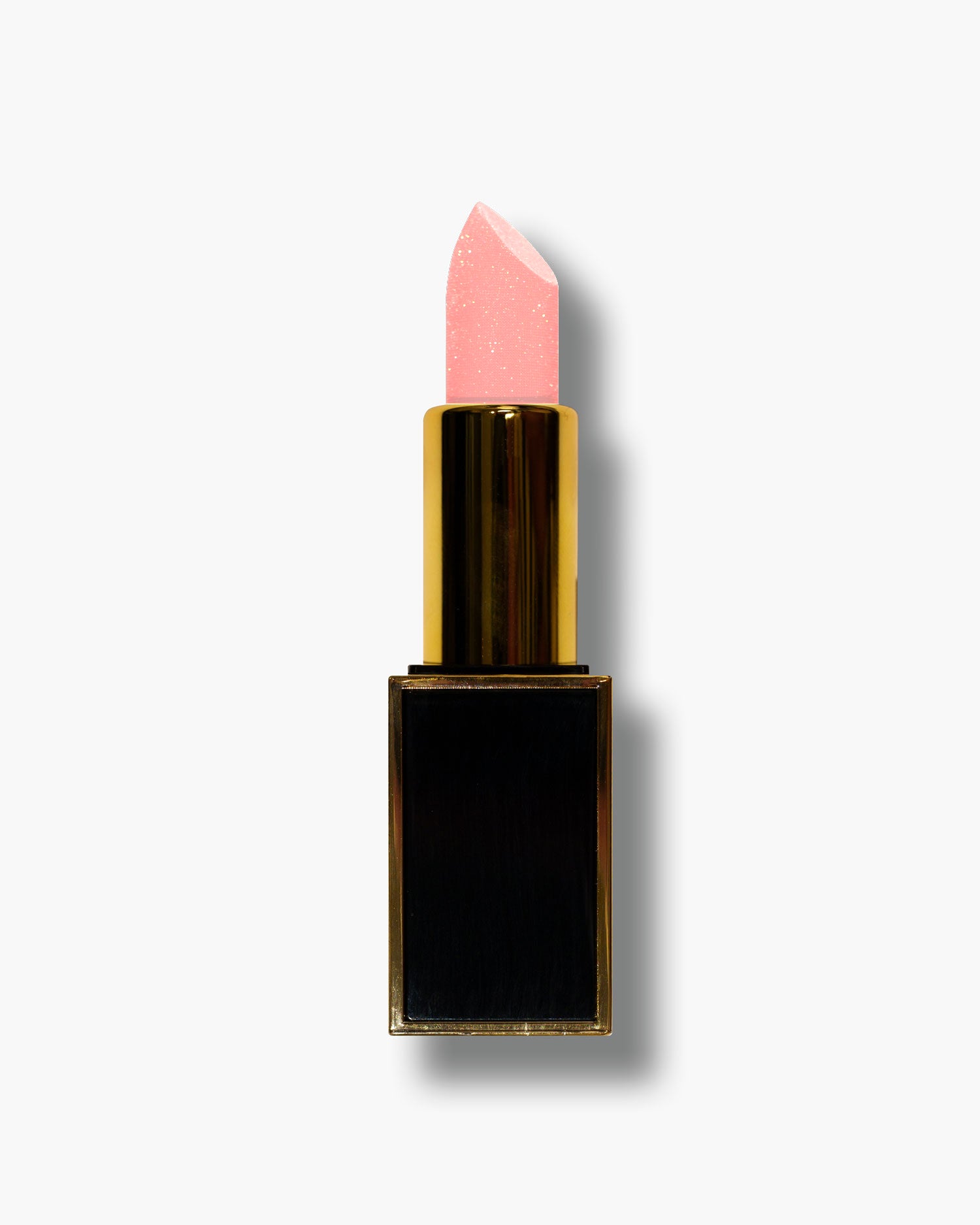 Seint Lipstick in Diamonds — pale pink bullet flecked with gold glitter in a gold tube on a square black base