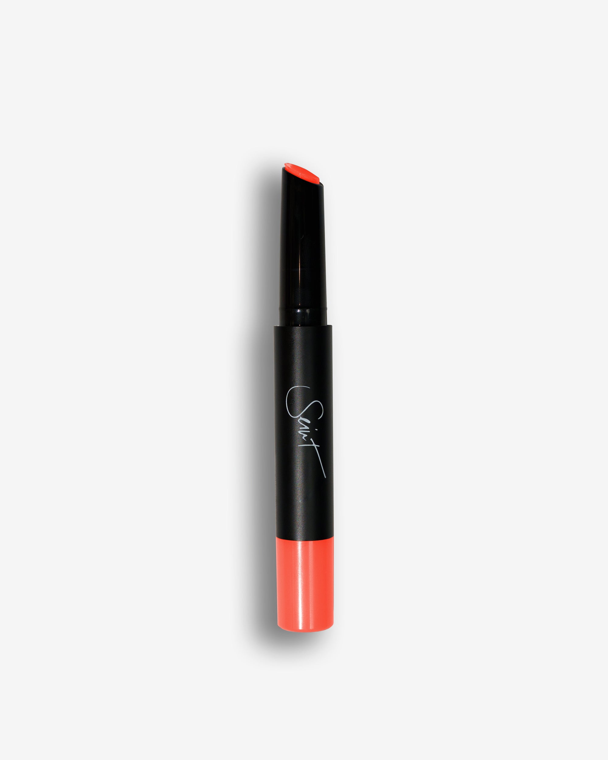 Seint Lip Gelato in Melon shows a bright coral-orange cream at its slanted black tip