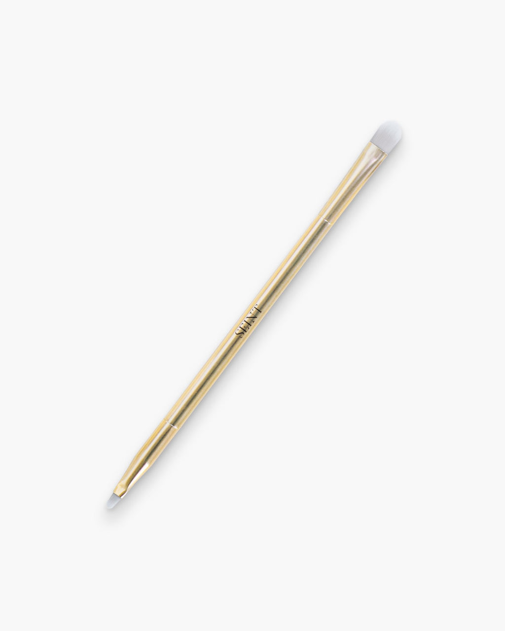 Seint Multitasker Brush in gold — slim double-ended brush with a rounded shading tip and a fine detail end
