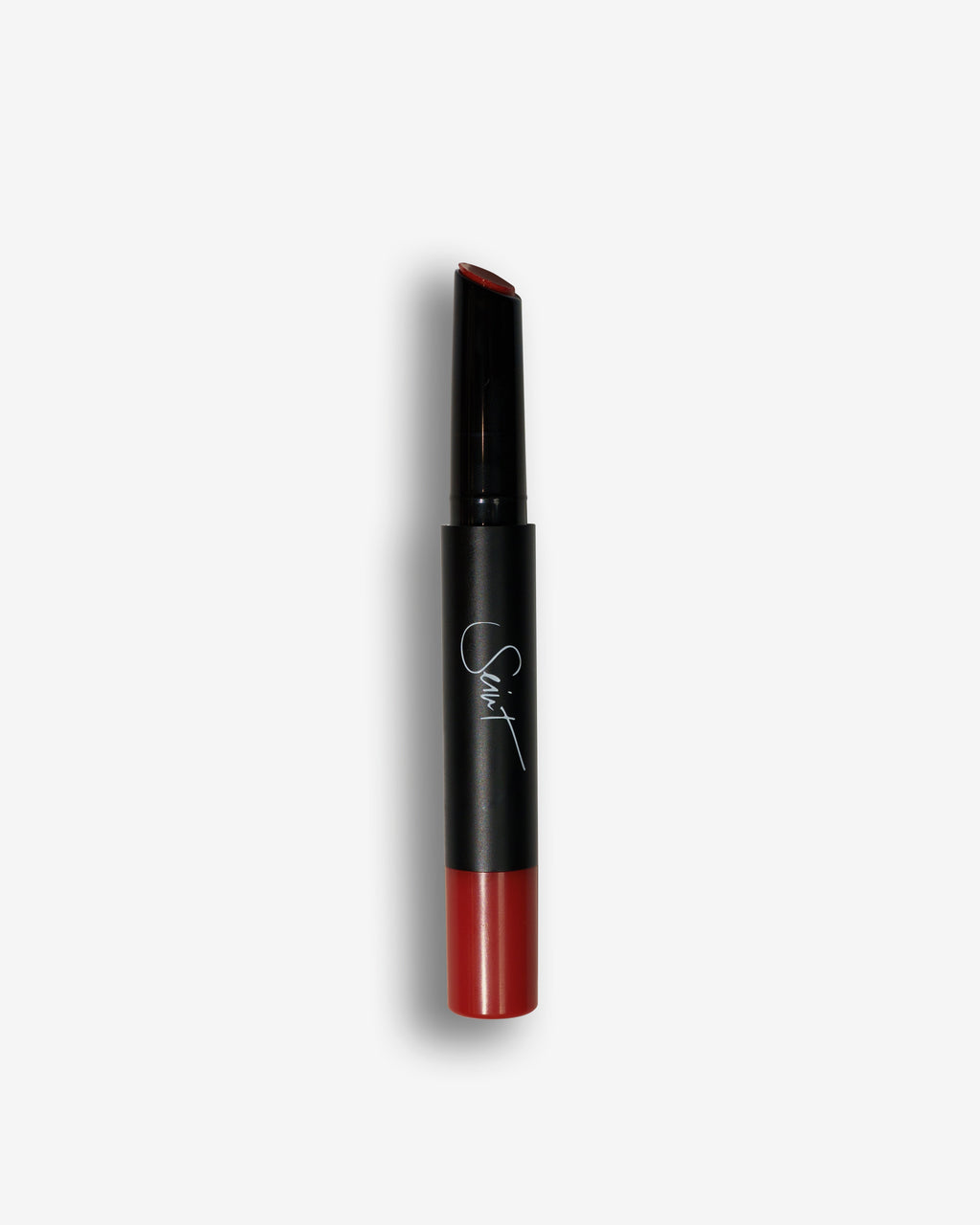 Seint Lip Gelato in Pomegranate, its slanted tip and base a deep brick-red cream