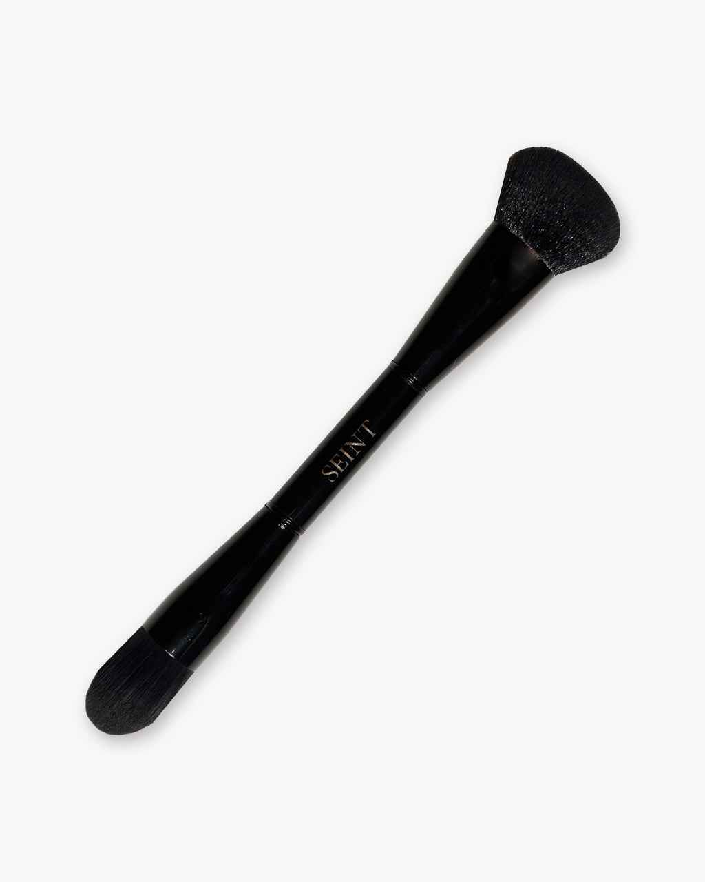 Seint Pilot Brush in glossy black with a full angled powder head on one end and a smaller tapered head on the other
