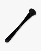 Seint Pilot Brush in glossy black with a full angled powder head on one end and a smaller tapered head on the other
