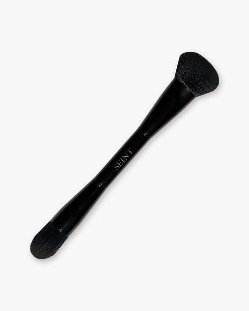 Seint Pilot Brush in glossy black with a full angled powder head on one end and a smaller tapered head on the other