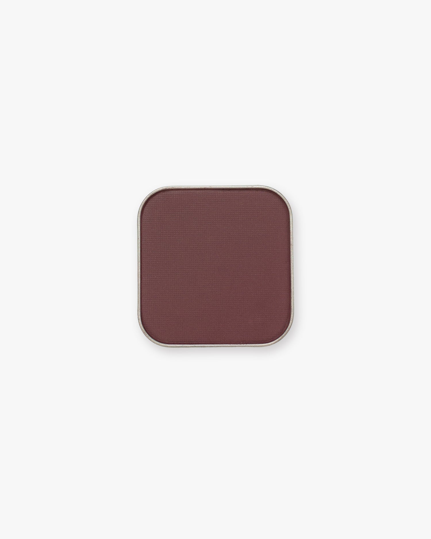 Seint Pressed Pigment in Baker Street, a deep plum-brown matte powder in a square silver tin