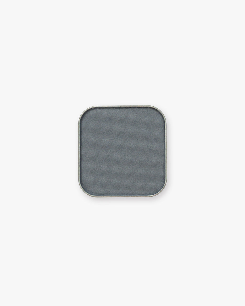 Seint Pressed Pigment in Blue Suede, a muted slate blue-gray powder in a silver-edged pan