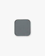 Seint Pressed Pigment in Blue Suede, a muted slate blue-gray powder in a silver-edged pan