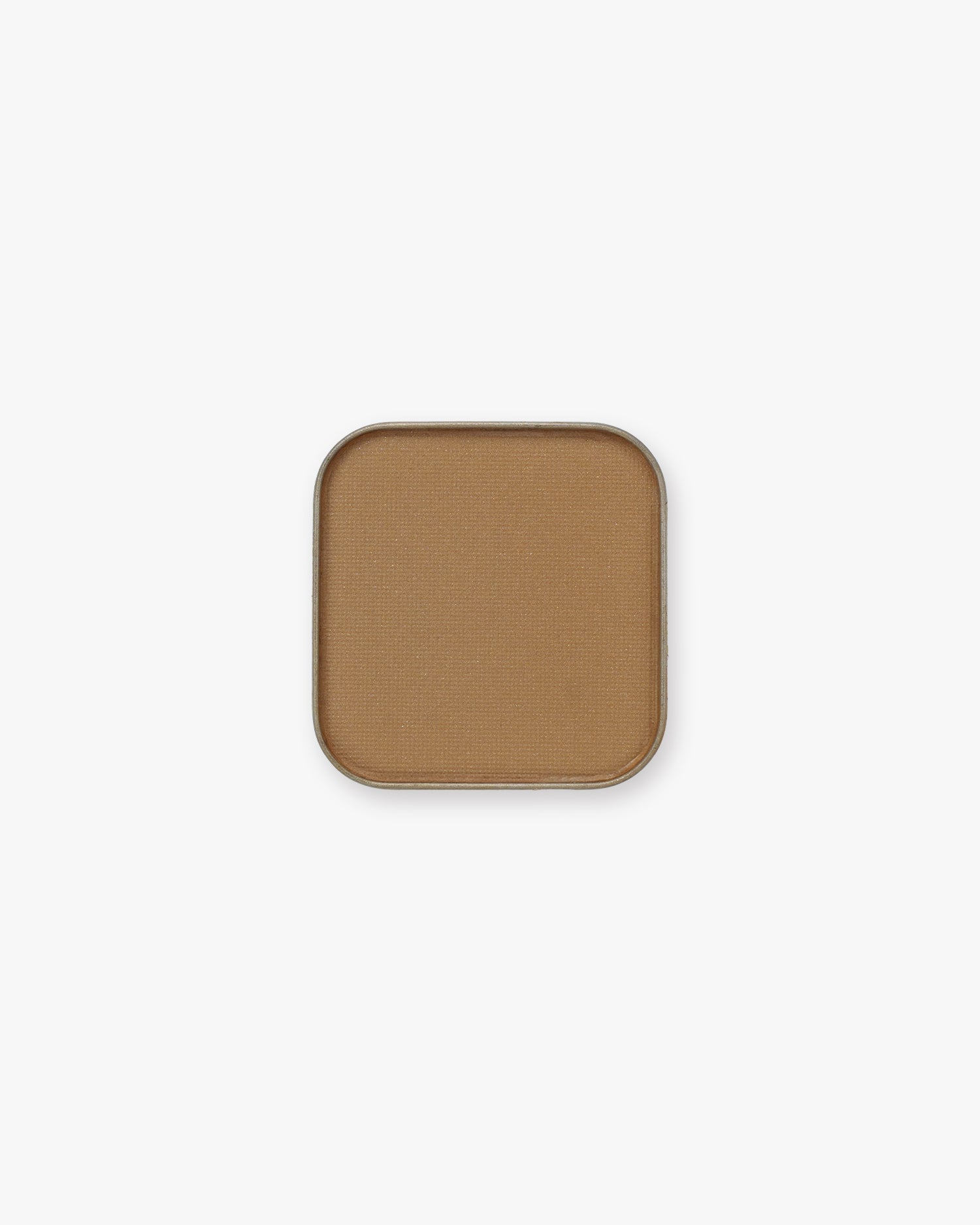Warm caramel-tan Seint Pressed Pigment in Cowboy, pictured in its square metal tin