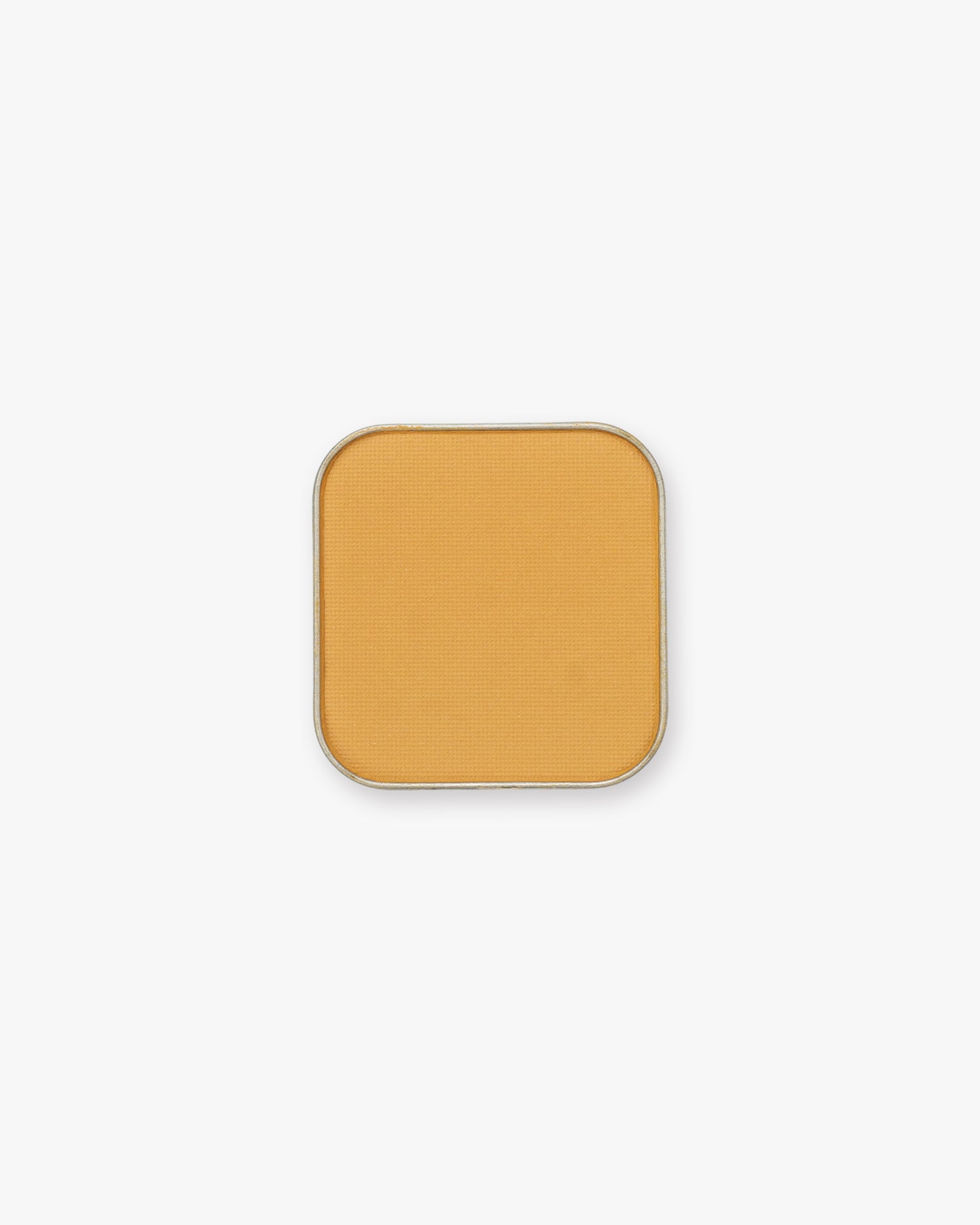 Seint Pressed Pigment in Daisy, a warm honey-gold matte powder in a rounded square tin