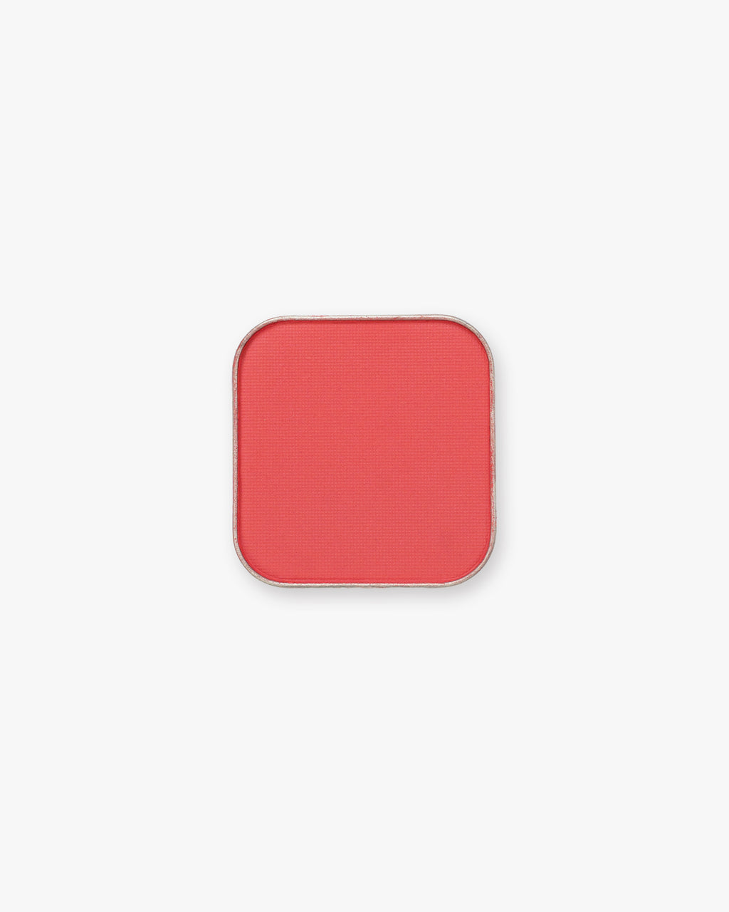 Seint Pressed Pigment in Everly, a punchy coral-red matte powder in a rounded square tin