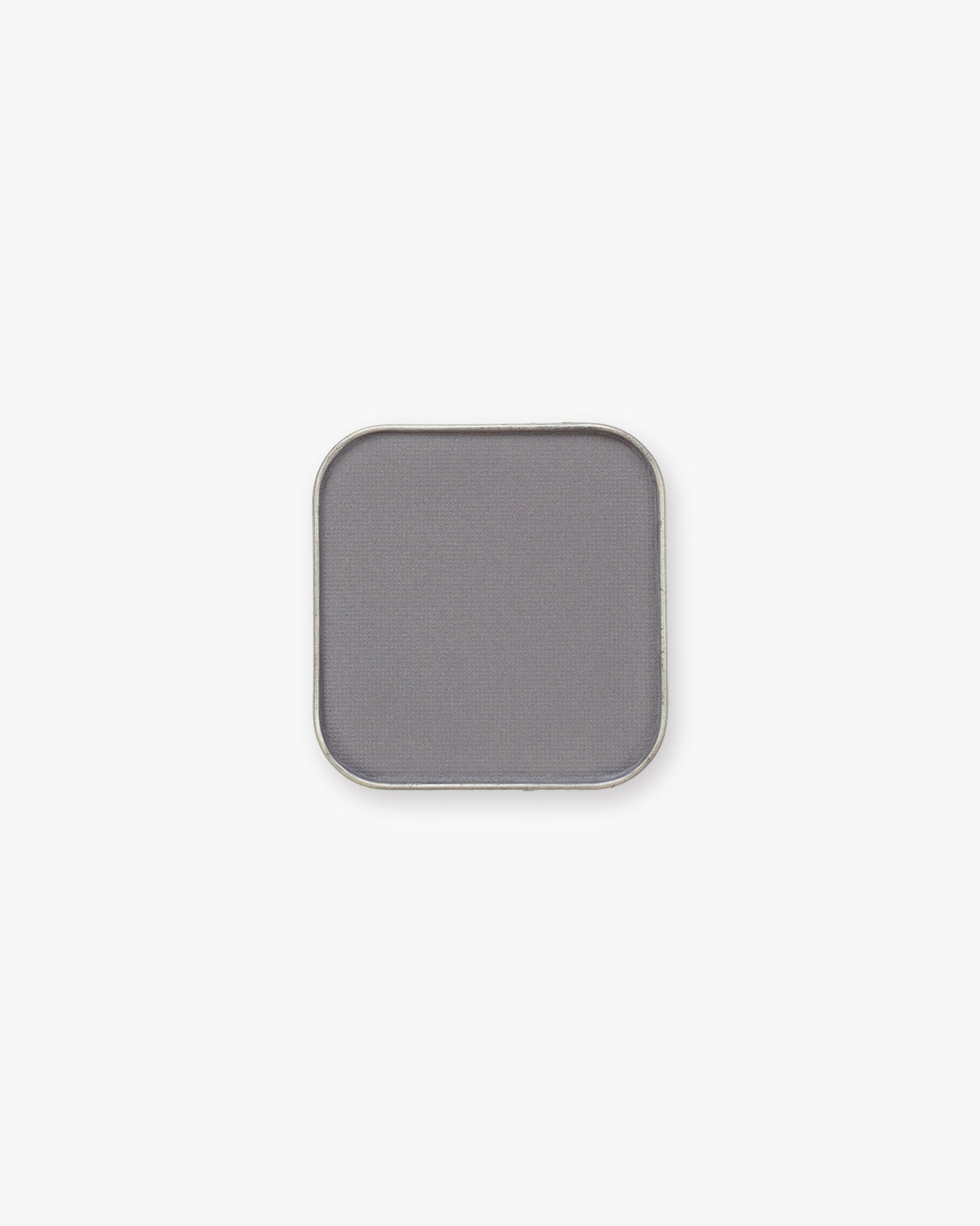 Seint Pressed Pigment in Figaro, a cool stone-gray matte powder in a rounded metal pan