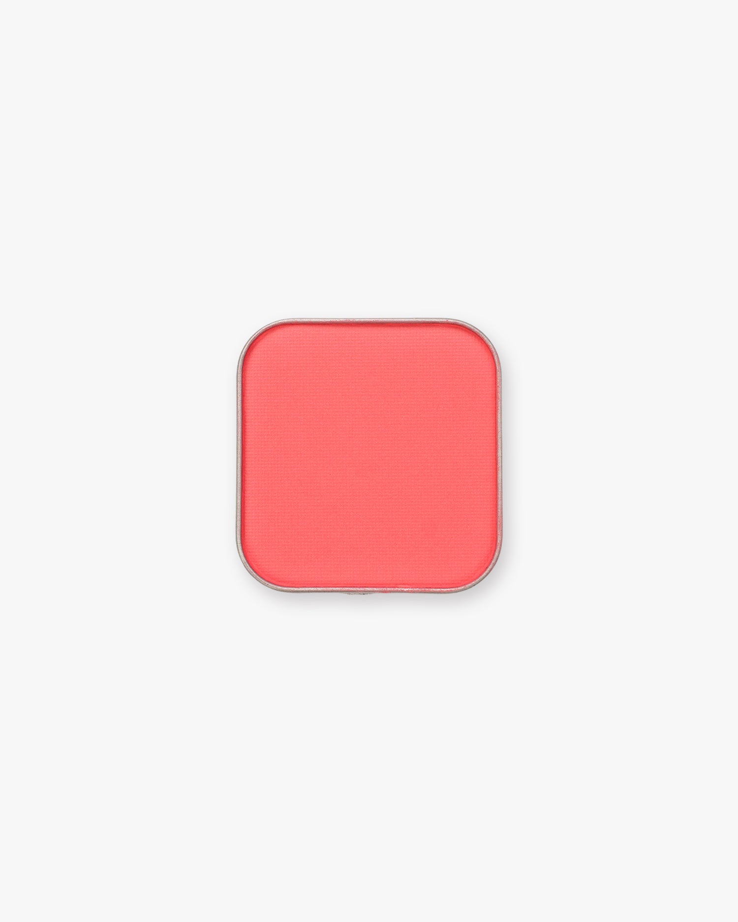 Seint Pressed Pigment in Guava glows watermelon pink in its rounded square tin