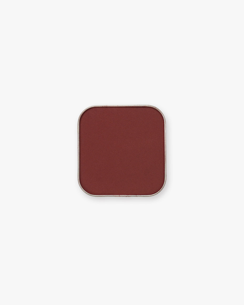 Seint Pressed Pigment in Honeymoon shows a rich brick-red matte powder in a square tin