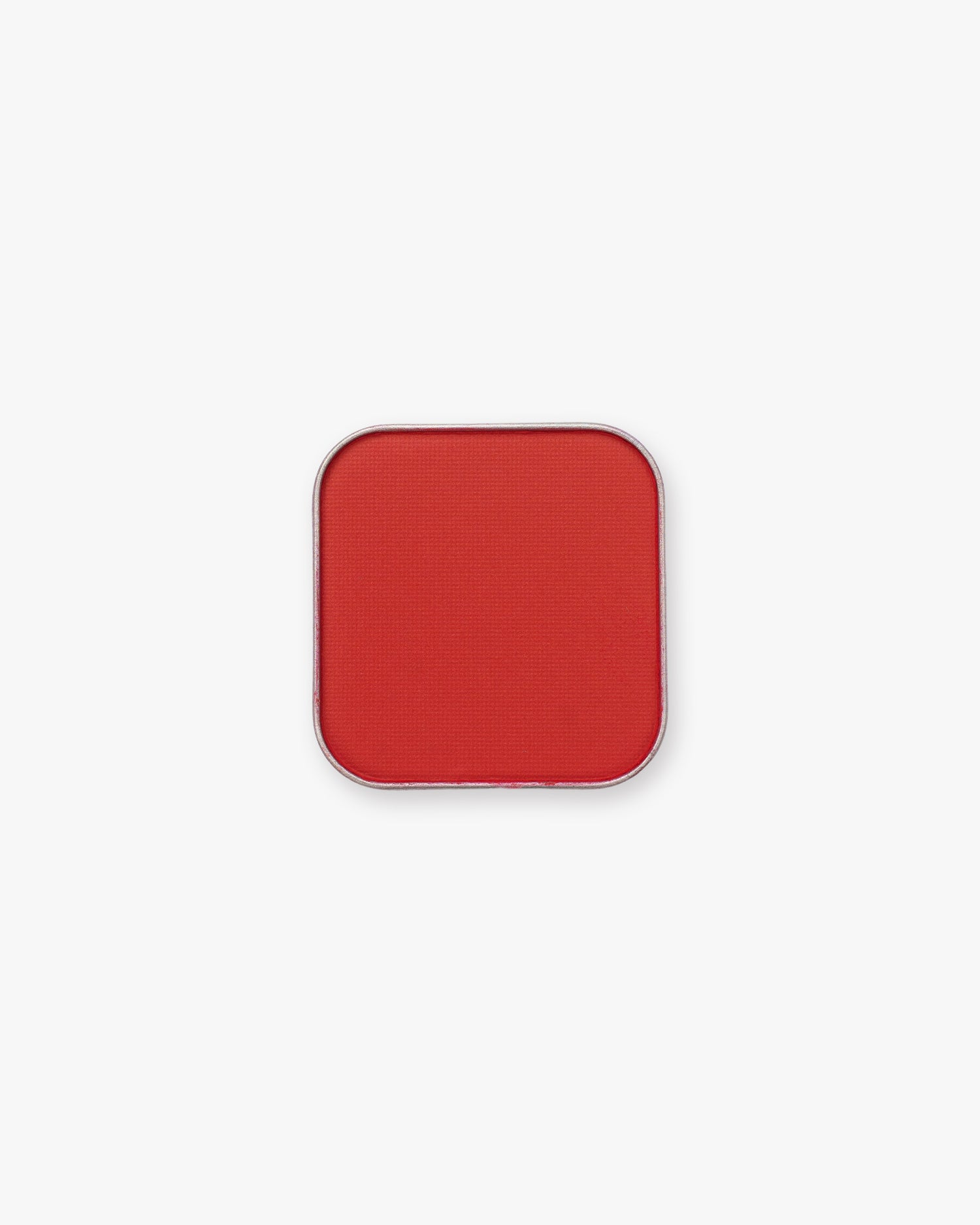 Seint Pressed Pigment in Lady Bug, a bold true-red matte powder in a square silver tin