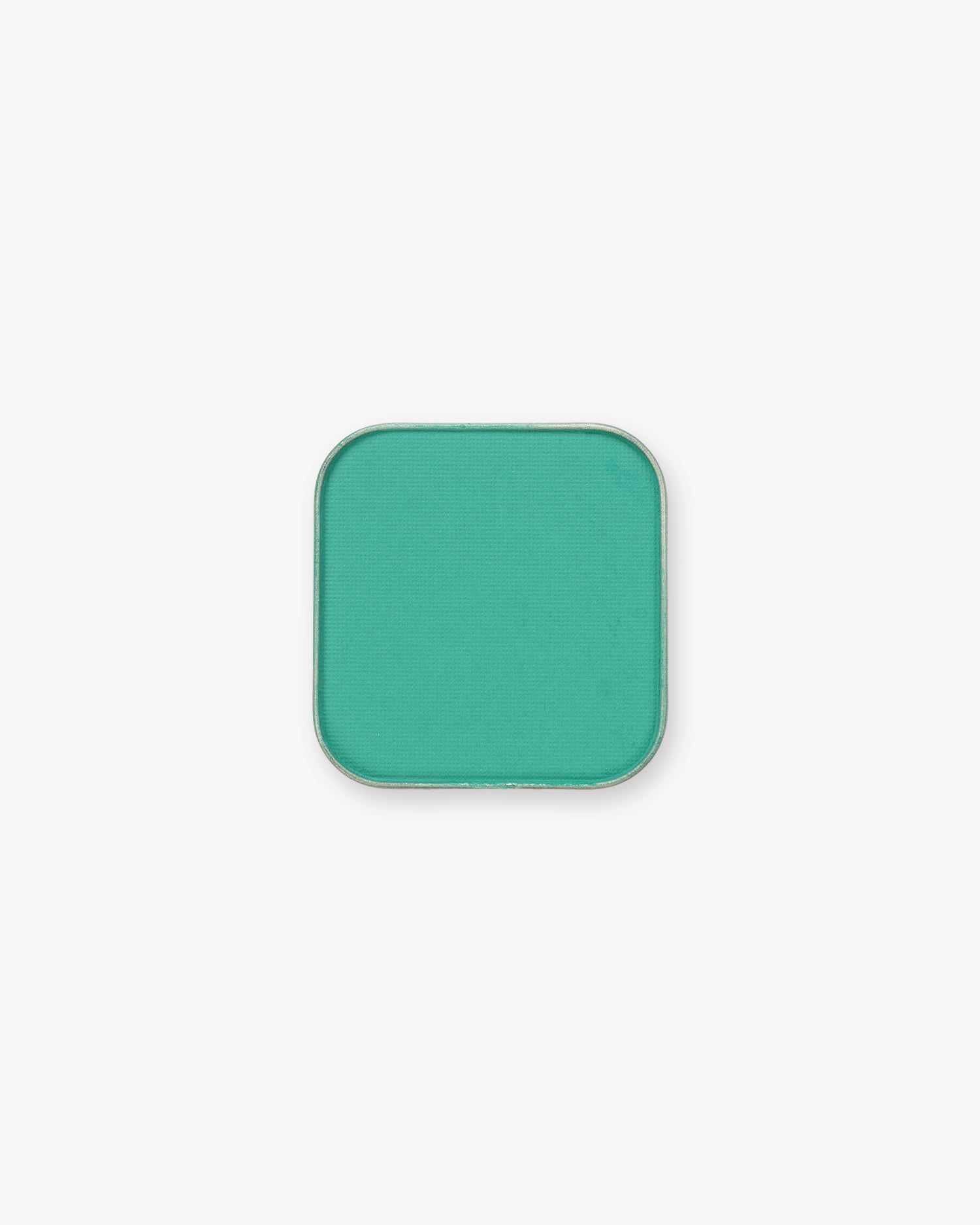 Seint Pressed Pigment in Maldives, a bright turquoise-jade matte powder in a metal pan