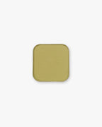 Seint Pressed Pigment in Pistachio, a soft chartreuse yellow-green powder in a metal pan