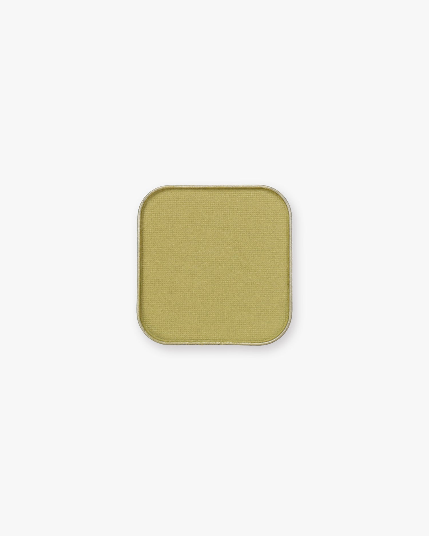 Seint Pressed Pigment in Pistachio, a soft chartreuse yellow-green powder in a metal pan