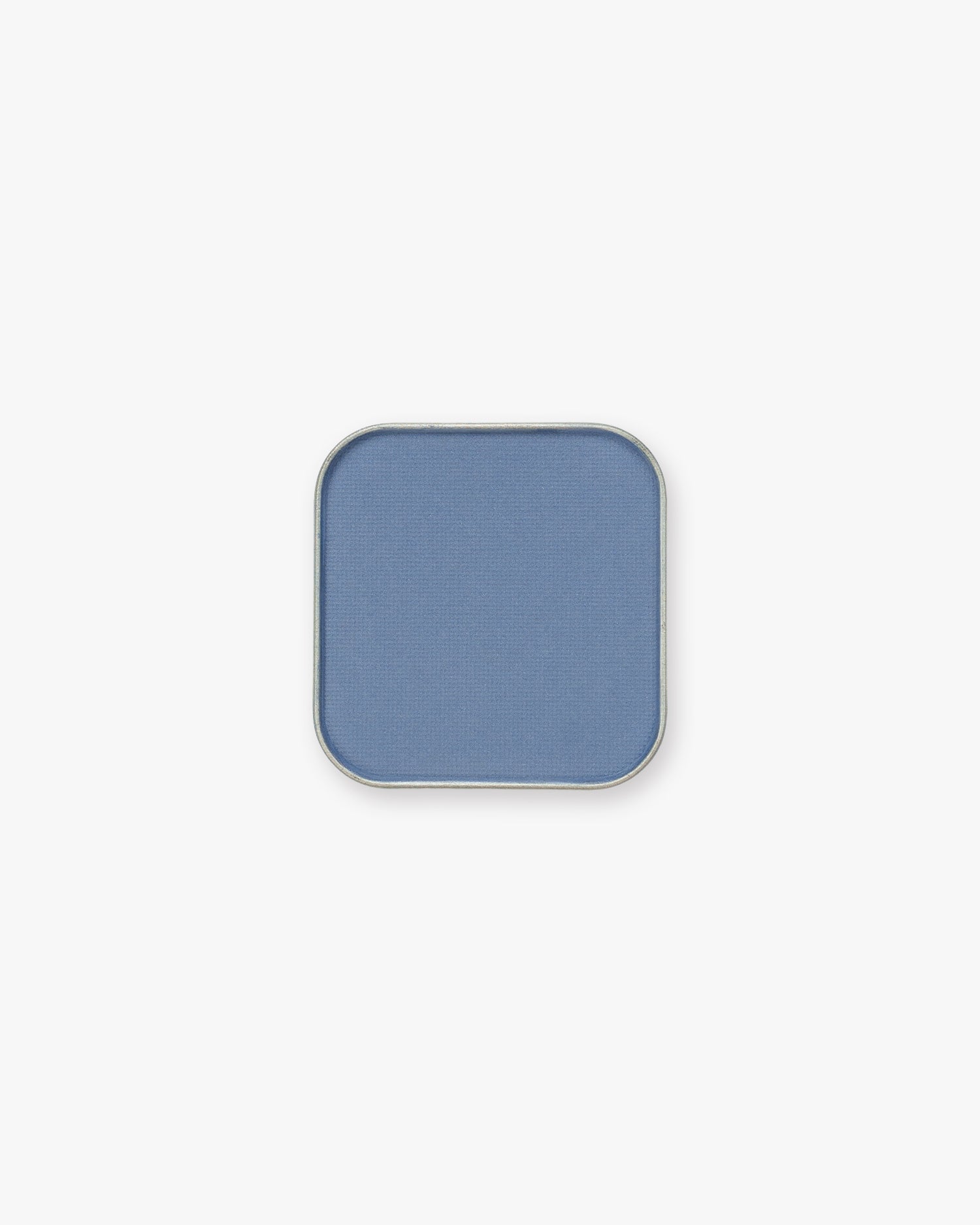 Seint Pressed Pigment in Raindrop, a soft cornflower-blue powder in a silver square tin