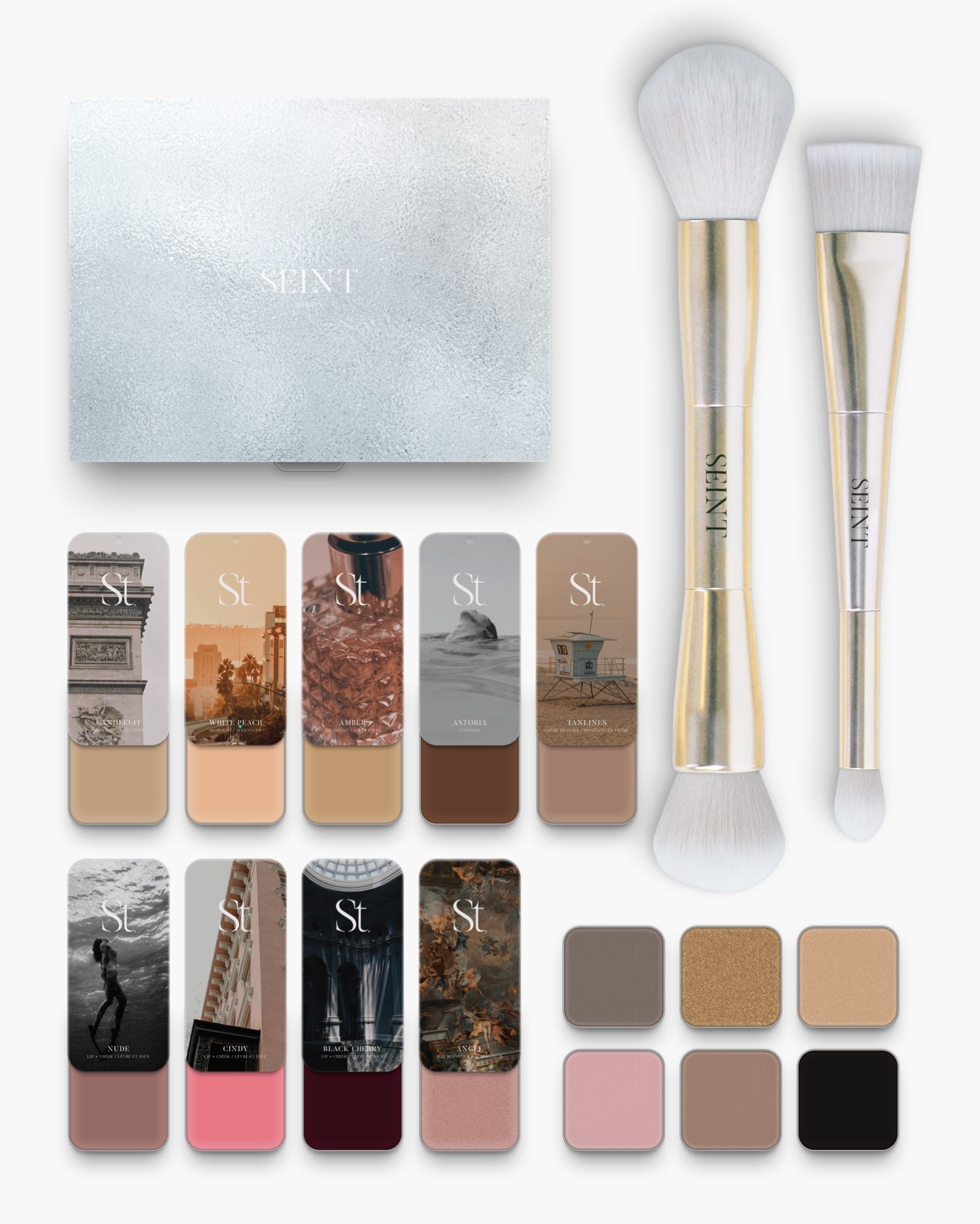 Seint No. 12 Collection Level II with light beige cream tins, soft pink blush, silver SEINT box, gold brushes and shadows