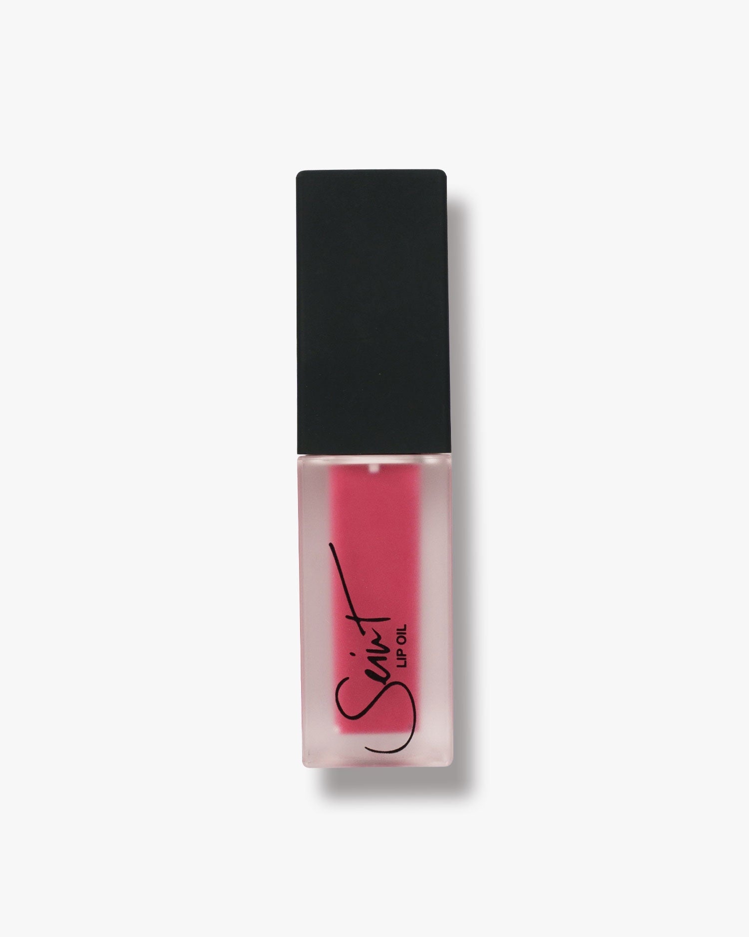 Seint Lip Oil in Sangria, vivid raspberry-pink oil filling the frosted square bottle