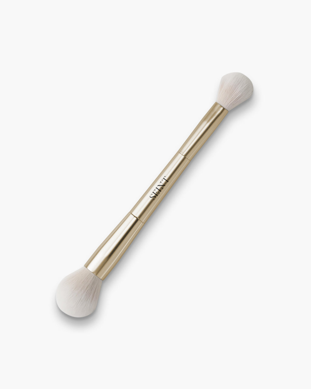 Seint Shape Brush in gold with two fluffy white dome heads, a larger contour end and smaller blush end