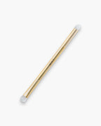 Seint Smudge Brush in gold — double-ended metal handle with SEINT wordmark and soft white domed bristle tips at each end