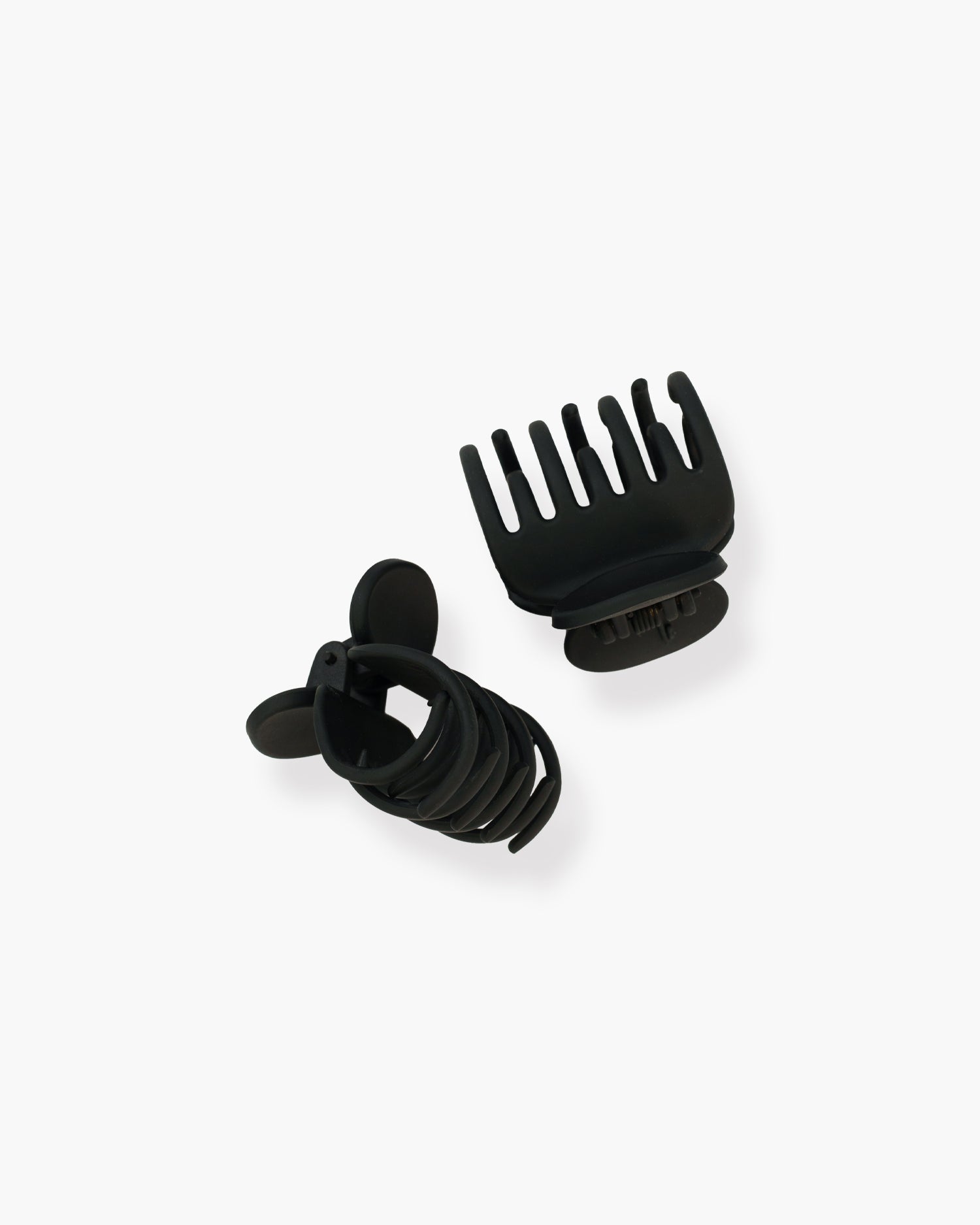 Seint The Hair Clip matte black mini claw clips, one upright showing interlocking teeth and one resting on its side
