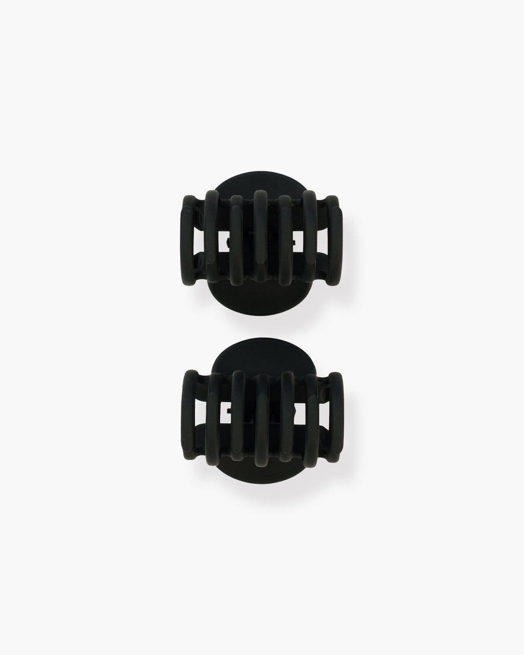 Seint The Hair Clip set of two closed matte black claw clips viewed from above with rounded oval tops