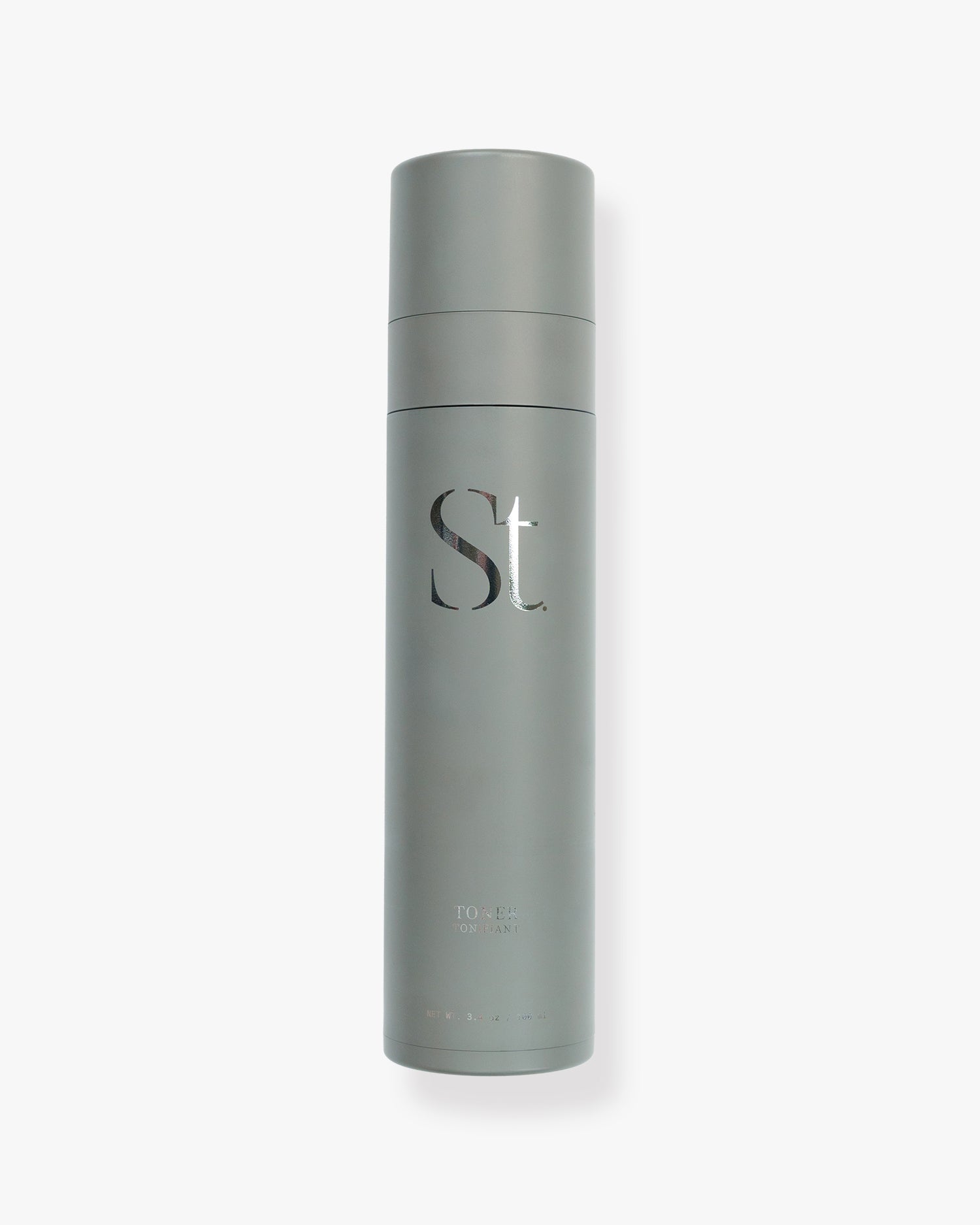 Seint Toner in a slim sage-gray 100 ml bottle with a silver-foil serif monogram