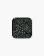 Seint 1/2 Brush Cleaning Tile overhead view, the compact square tin holding a black honeycomb-textured sponge