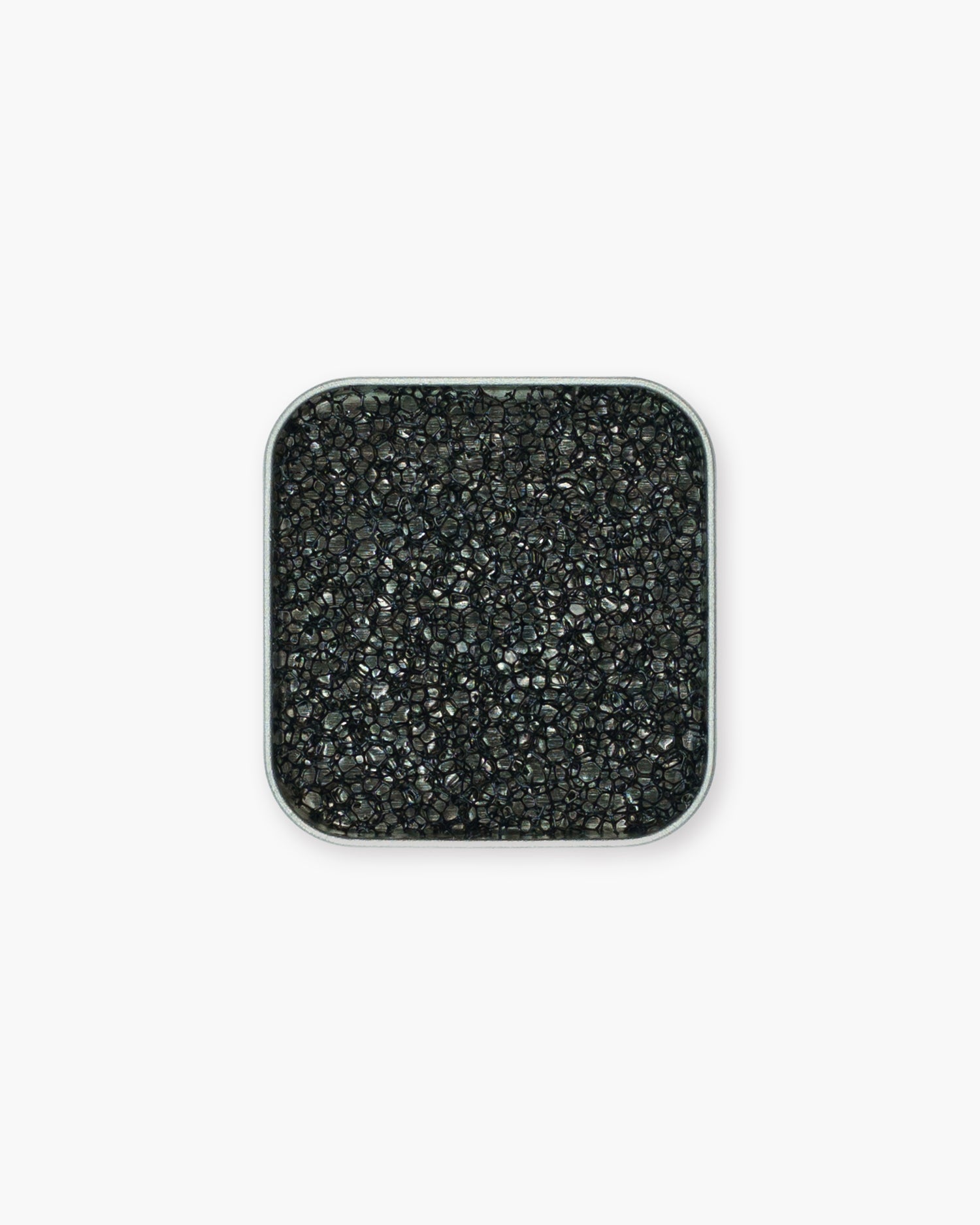 Seint 1/2 Brush Cleaning Tile overhead view, the compact square tin holding a black honeycomb-textured sponge
