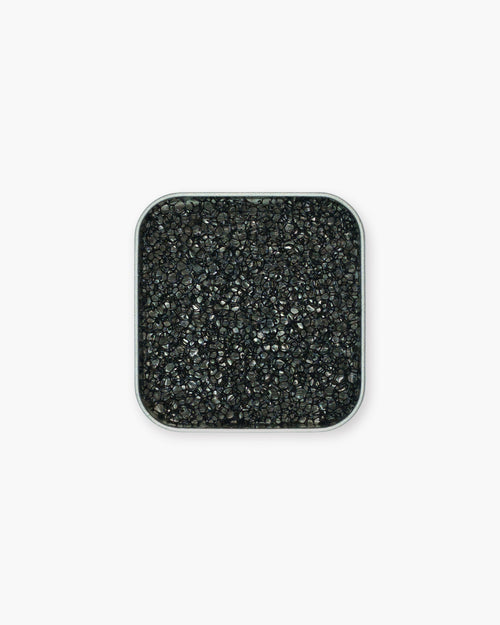 Seint 1/2 Brush Cleaning Tile overhead view, the compact square tin holding a black honeycomb-textured sponge