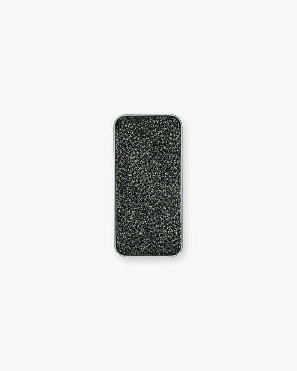 Seint Brush Cleaning Tile from above: a black open-cell sponge texture filling the rectangular silver tin
