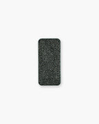 Seint Brush Cleaning Tile from above: a black open-cell sponge texture filling the rectangular silver tin