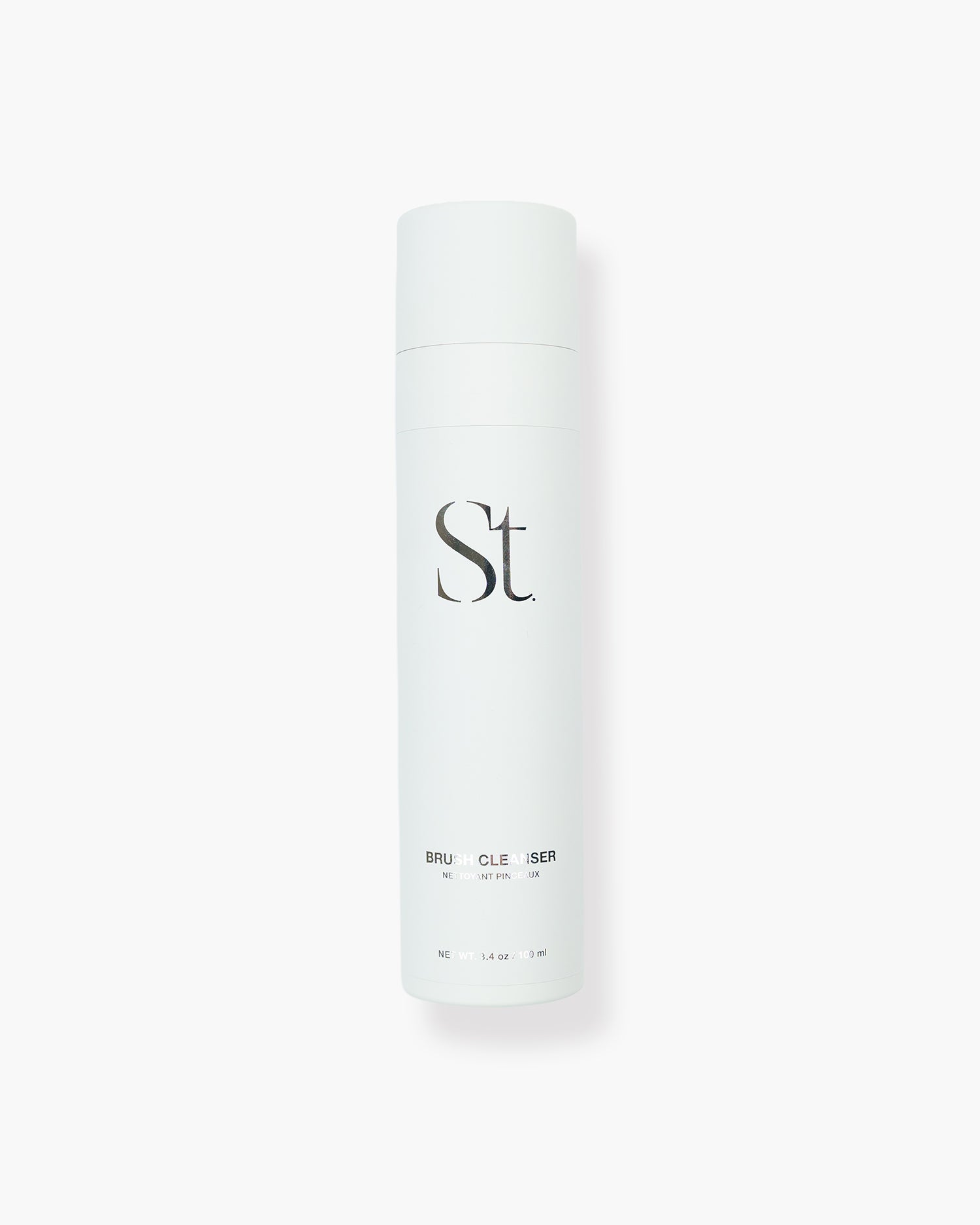 Seint Brush Cleanser in a white 3.4 oz spray canister with the Seint monogram, shown upright on a white background