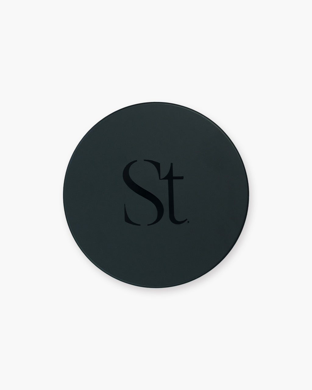 Seint Brush Cleansing Soap round black tin closed, its lid marked with the Seint monogram