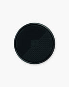 Seint Brush Cleansing Soap silicone lid detail: black scrubbing pad with raised dot texture for deep-cleaning brushes