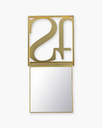 Seint Mercury Compact Mirror unfolded, gold monogram lid flipped up to reveal the square mirror below