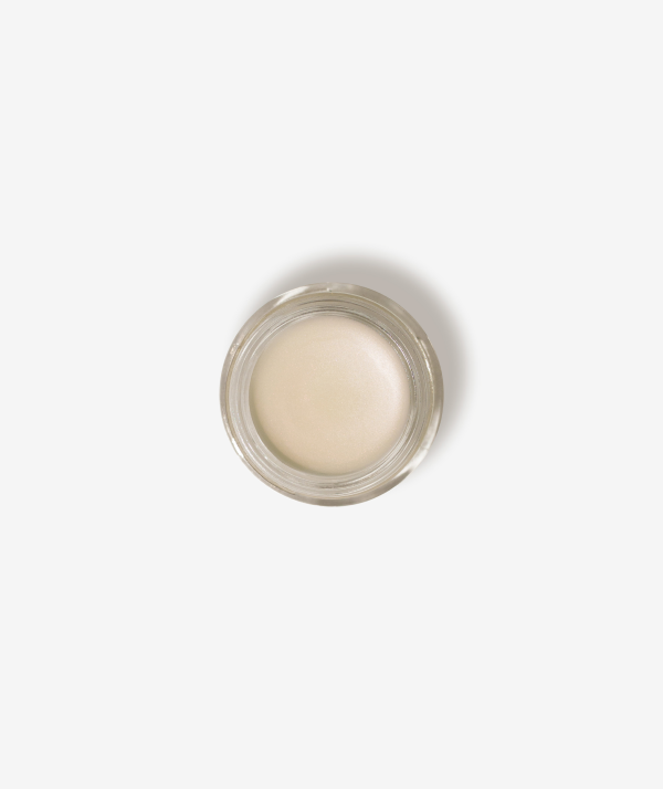Seint Lip Balm open glass jar seen from above, filled with smooth ivory balm