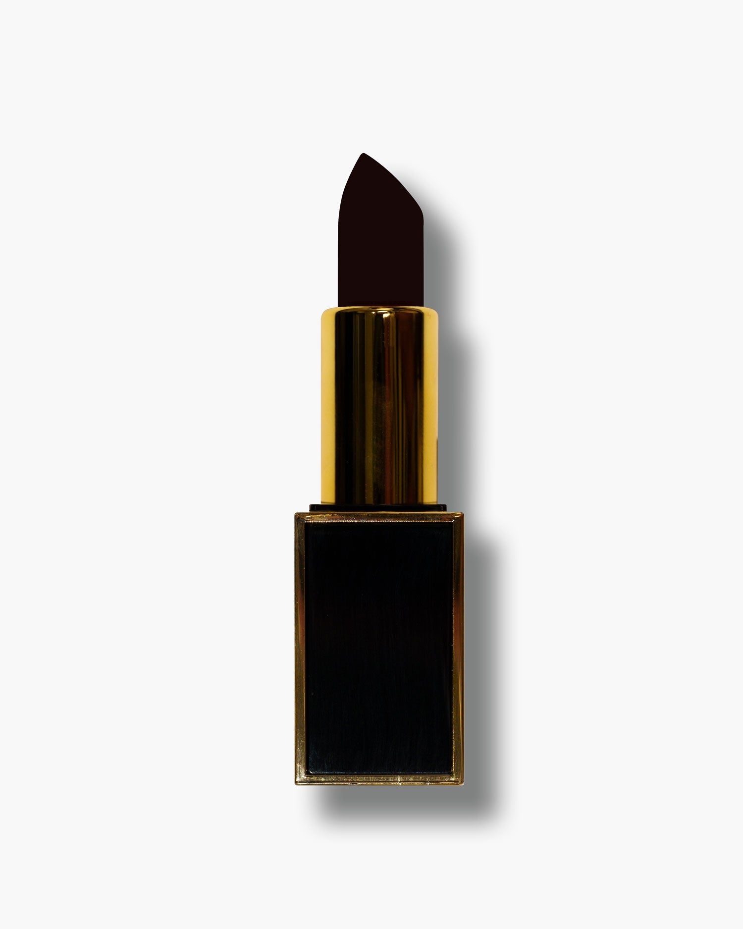Seint Lipstick in Black Cherry: near-black plum angled bullet, gold tube and glossy black square base