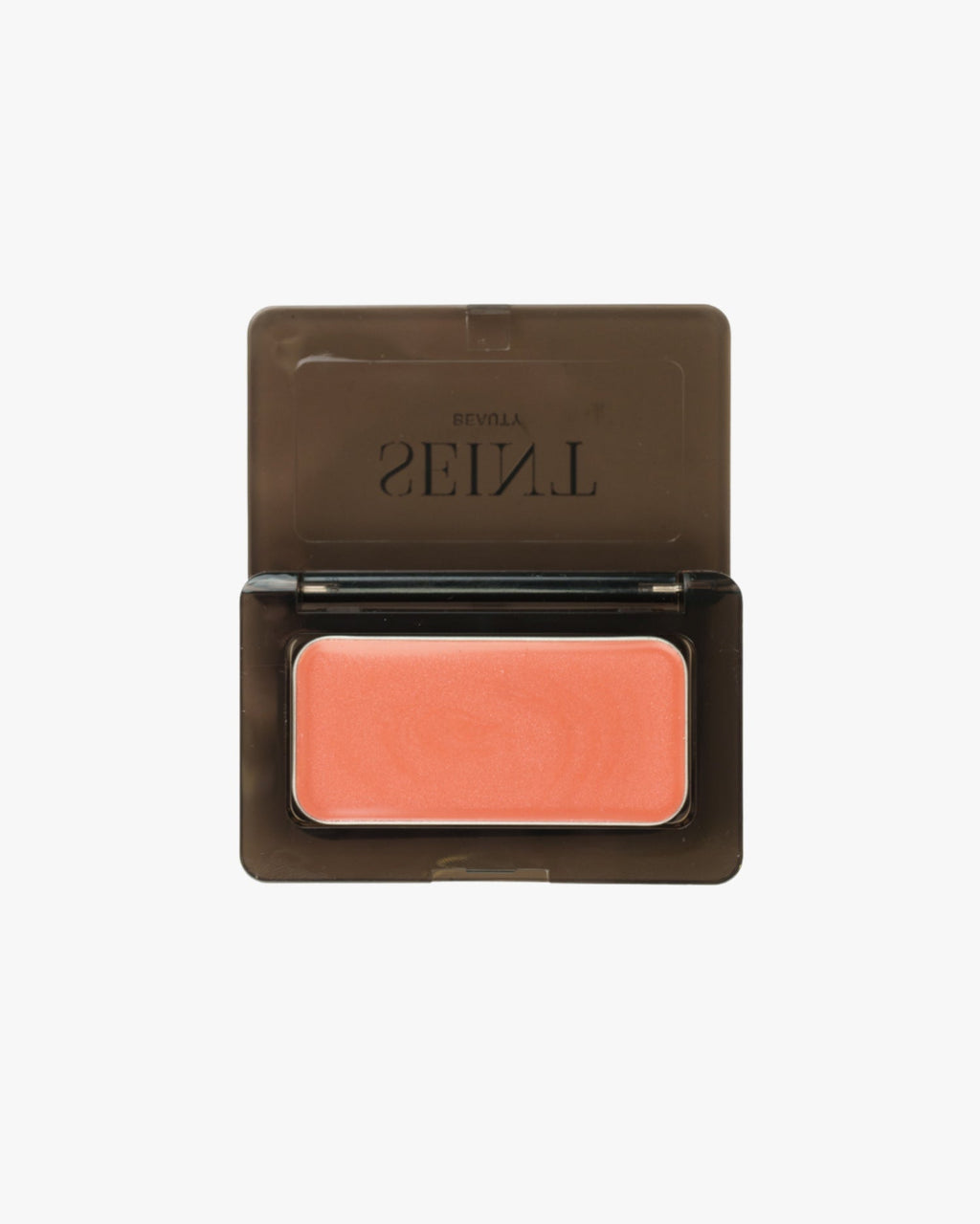 Seint Mini Compact open flat to show a single coral cream tin seated inside the black case