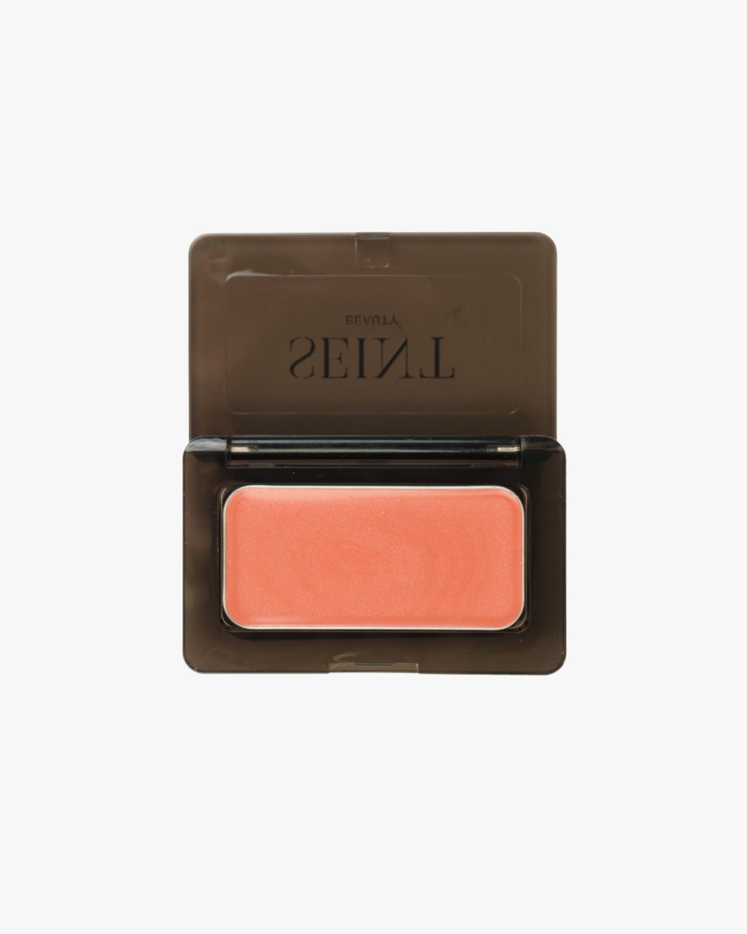 Seint Mini Compact open flat to show a single coral cream tin seated inside the black case