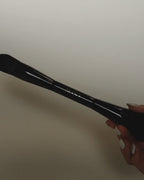 Video: Seint Pilot Brush held in hand, showing the glossy black handle and angled flat brush end