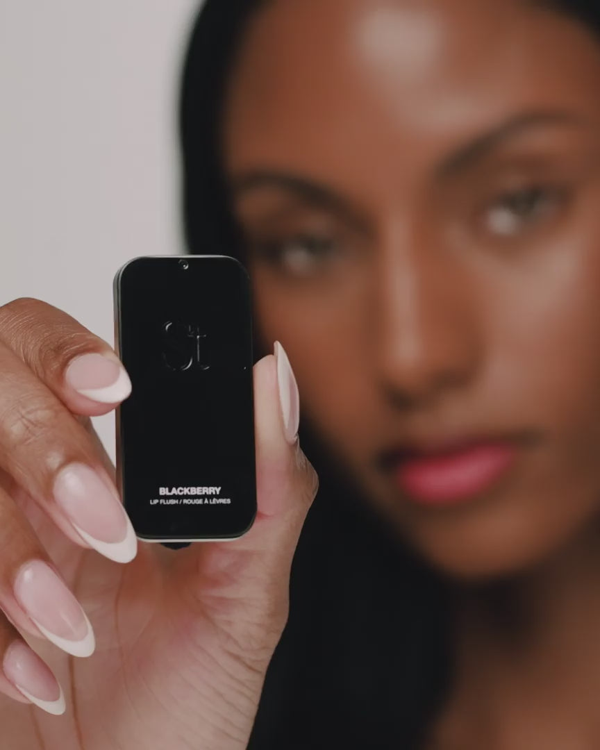 Video: model presents the Seint Blackberry Lip Flush slide-top tin, showing the lid and shade name